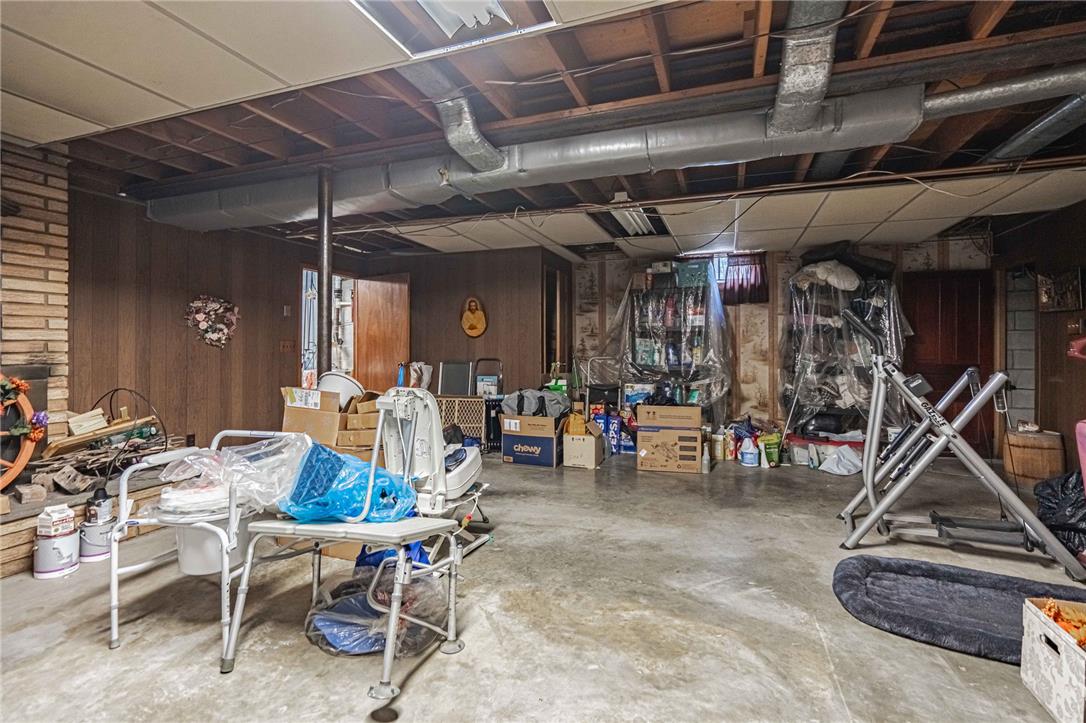 579 Cherry Road Northampton, PA 18067 - Photo 40 of 57 A partially finished basement with exposed joists and brick detailing offers ample storage space and development potential.