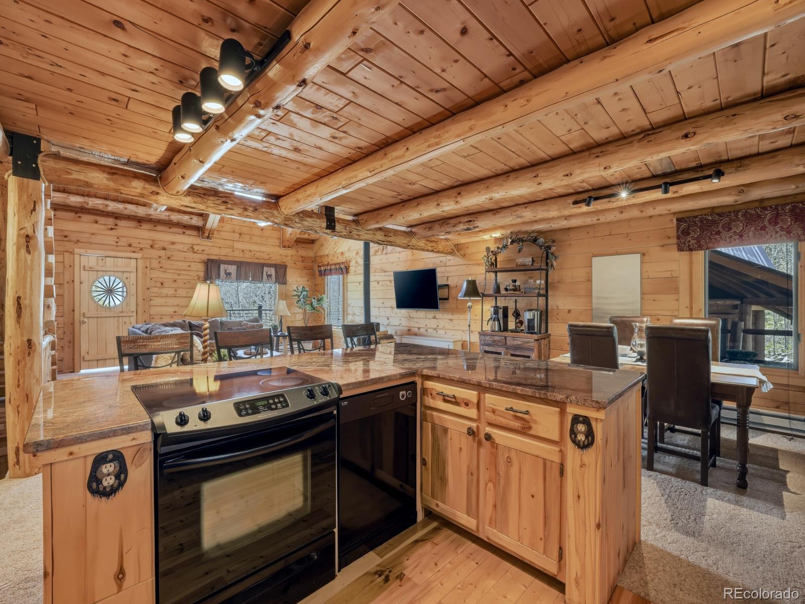 341 Anderson Road Walden, CO 80480 - Photo 29 of 50 a kitchen with a sink stove and cabinets