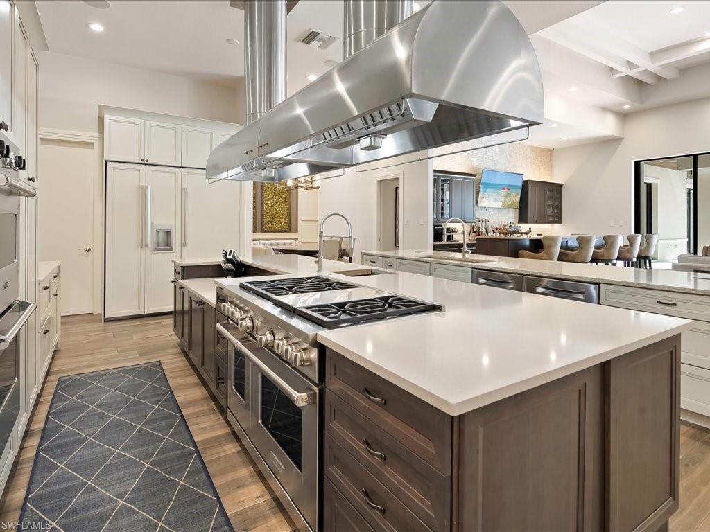 656 Hickory Road Naples, FL 34108 - Photo 12 of 50 a kitchen with a stove and a sink