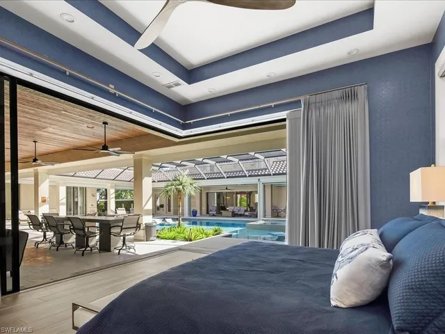 a bed room with a bed and a chair