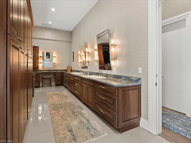 a large kitchen with a stove and refrigerator