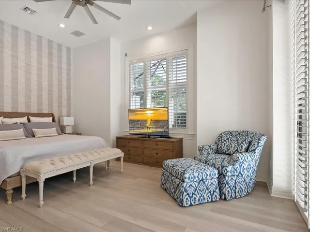 a bedroom with furniture and window