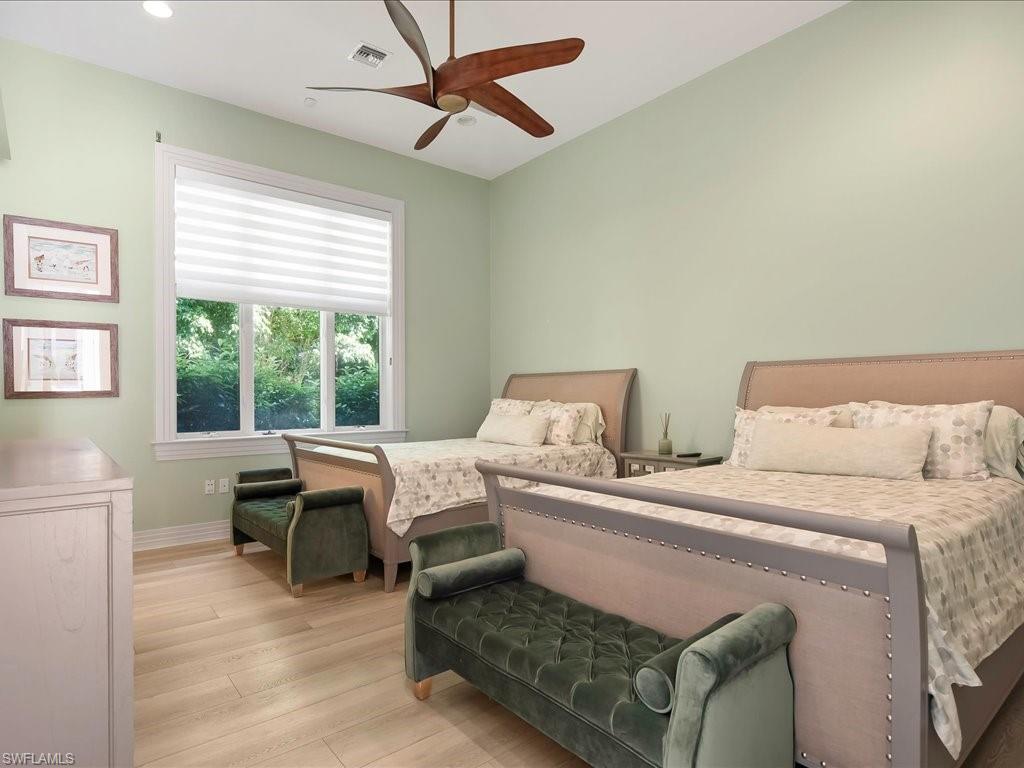 656 Hickory Road Naples, FL 34108 - Photo 27 of 50 a bed room with two bed and a window