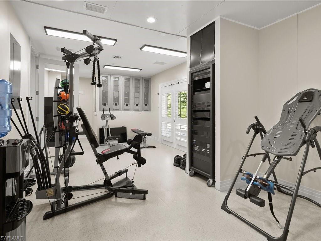 656 Hickory Road Naples, FL 34108 - Photo 28 of 50 a view of a room with gym equipment