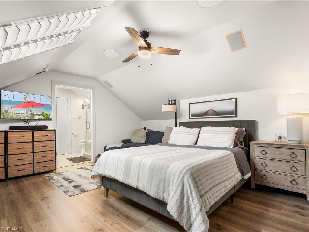 656 Hickory Road Naples, FL 34108 - Photo 29 of 50 a bedroom with a bed and a dresser