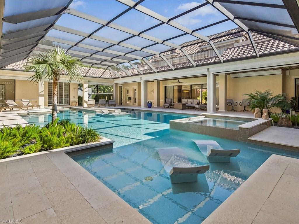 656 Hickory Road Naples, FL 34108 - Photo 30 of 50 a view of a patio with couches chairs and potted plants