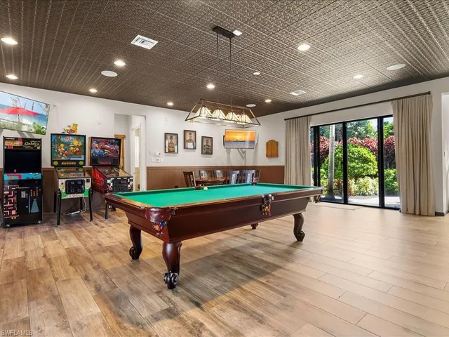 a large kitchen with a table and chairs