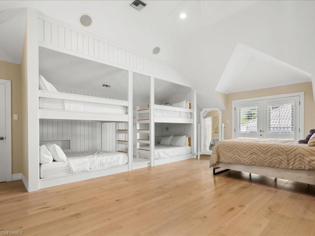 656 Hickory Road Naples, FL 34108 - Photo 41 of 50 a spacious bedroom with a bed and a window