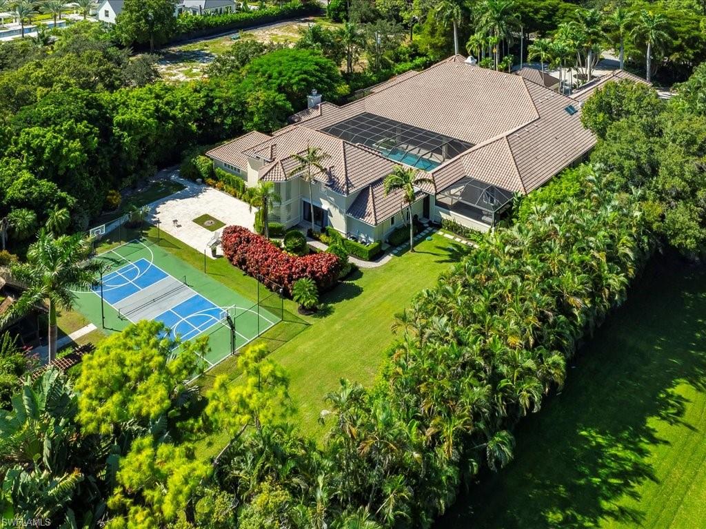 656 Hickory Road Naples, FL 34108 - Photo 42 of 50 an aerial view of a house with a garden