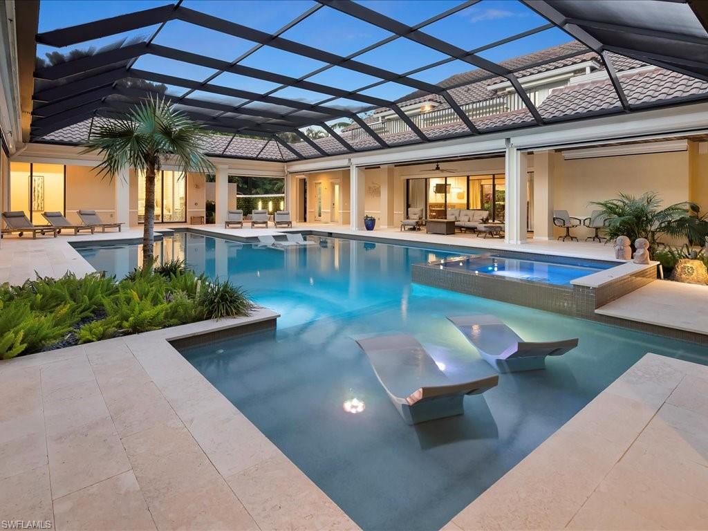 656 Hickory Road Naples, FL 34108 - Photo 45 of 50 a view of a swimming pool with a patio
