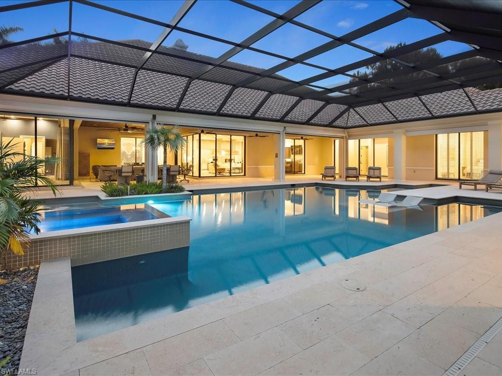 656 Hickory Road Naples, FL 34108 - Photo 46 of 50 a view of a swimming pool with a outdoor seating