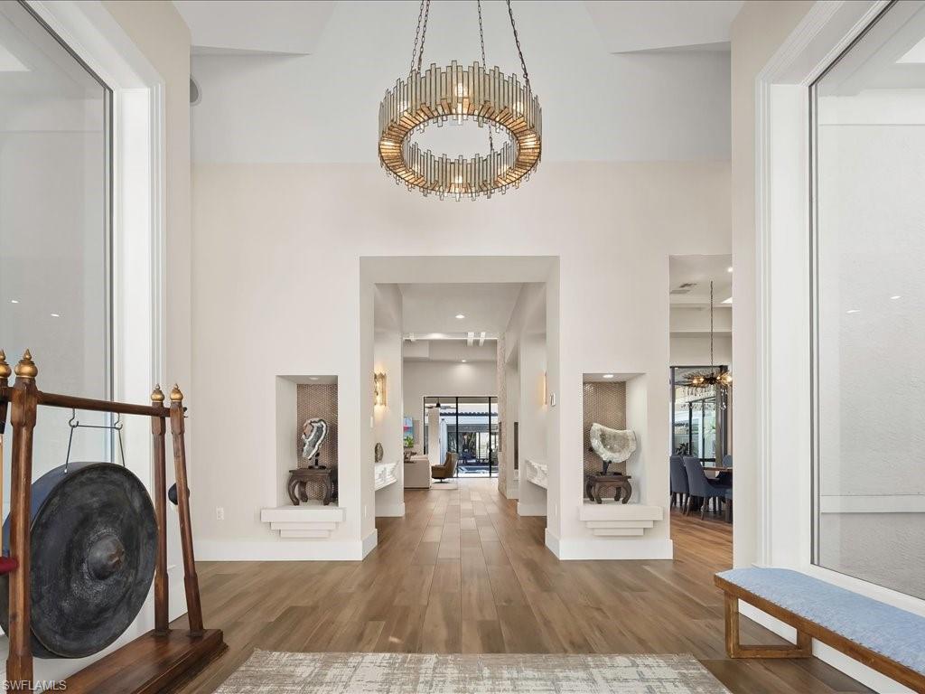 656 Hickory Road Naples, FL 34108 - Photo 5 of 50 a view of a hallway with washer and dryer