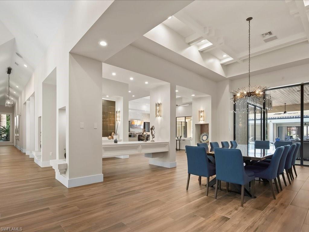 656 Hickory Road Naples, FL 34108 - Photo 8 of 50 a view of a dining room with furniture and wooden floor