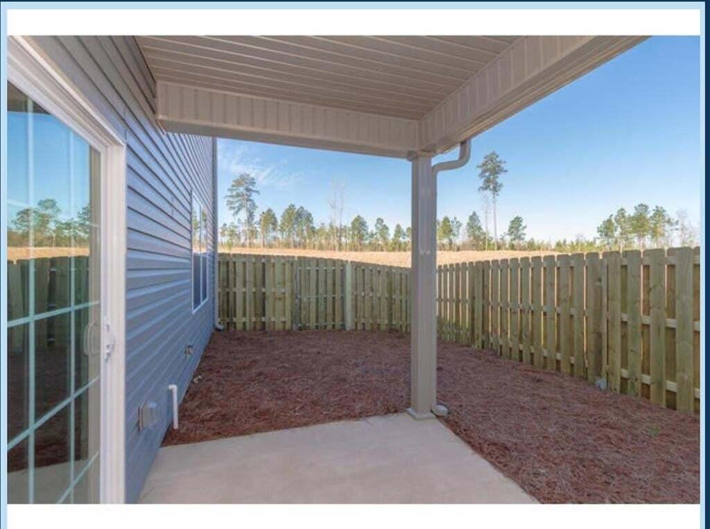710 Red Cedar Court Grovetown, GA 30813 - Photo 26 of 28 Covered Back Patio and privacy fenced backyard.