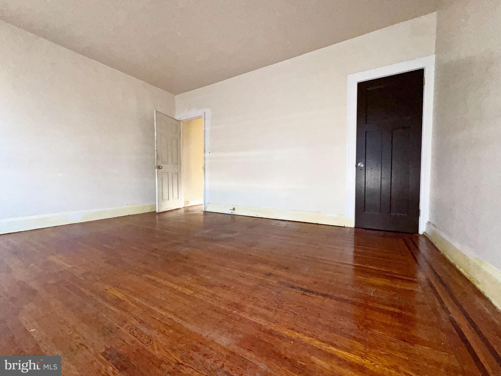 3323 Kenyon Avenue Baltimore, MD 21213 - Photo 13 of 20 wooden floor in an empty room