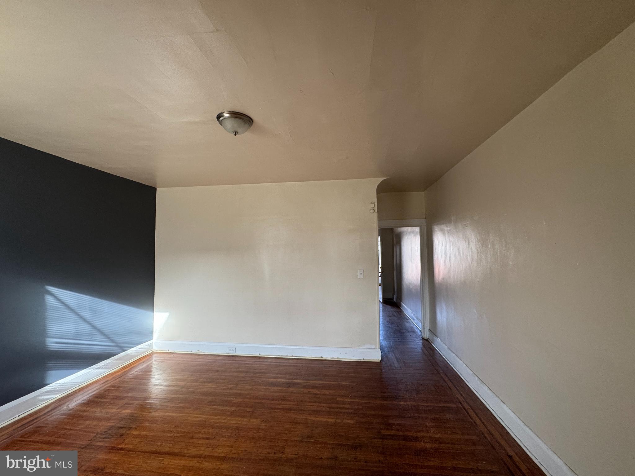 3323 Kenyon Avenue Baltimore, MD 21213 - Photo 7 of 20 a view of gallery with wooden floor
