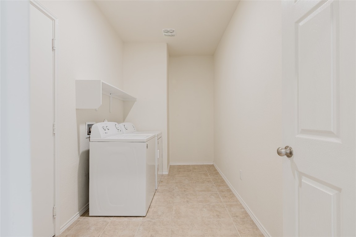 529 Gray Hawk Ridge Leander, TX 78641 - Photo 22 of 36 Washroom featuring separate washer and dryer and baseboards