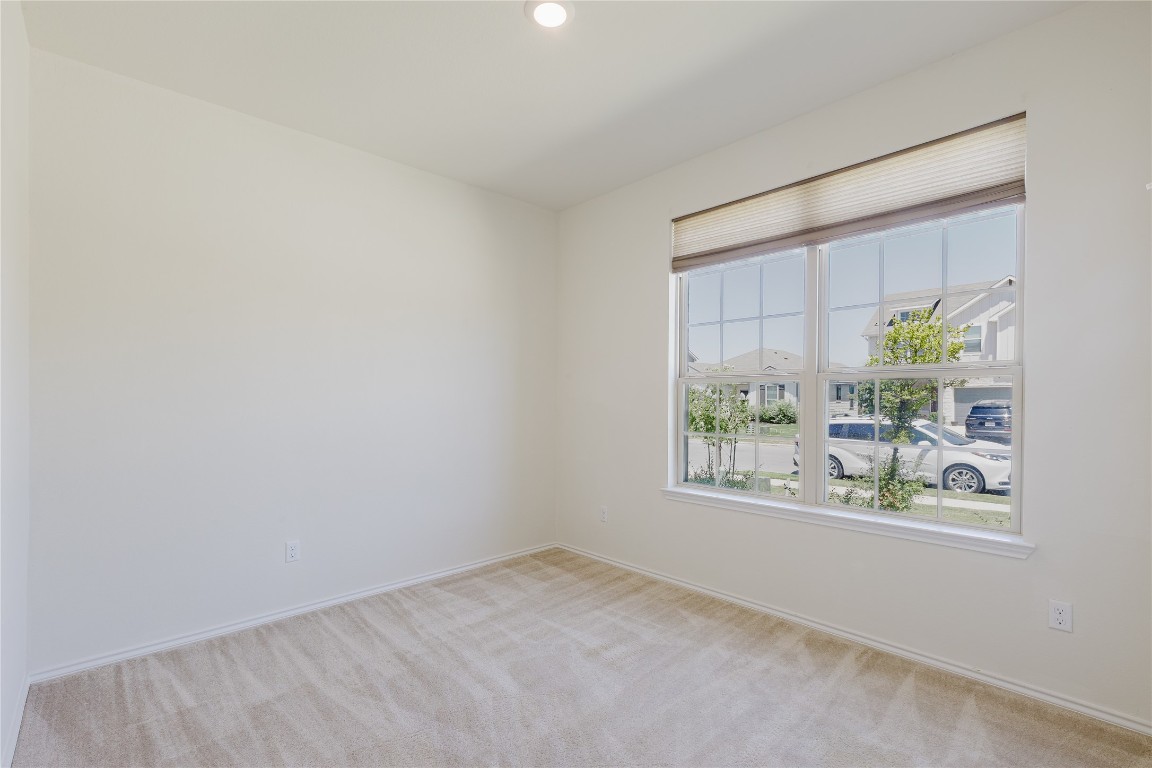 529 Gray Hawk Ridge Leander, TX 78641 - Photo 23 of 36 Carpeted spare room featuring baseboards