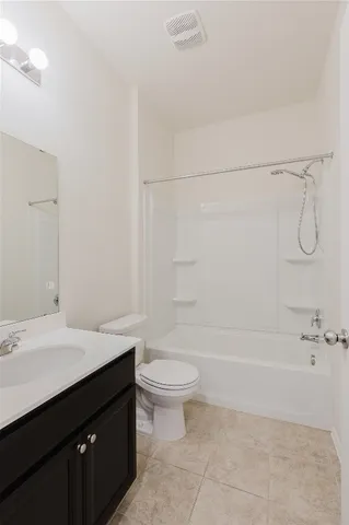 a bed room with a bed and a painting on the wall