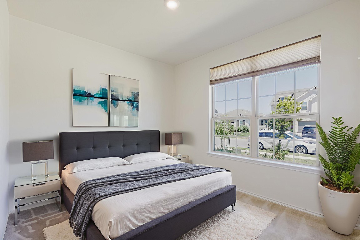 529 Gray Hawk Ridge Leander, TX 78641 - Photo 28 of 36 Bedroom featuring carpet flooring and baseboards