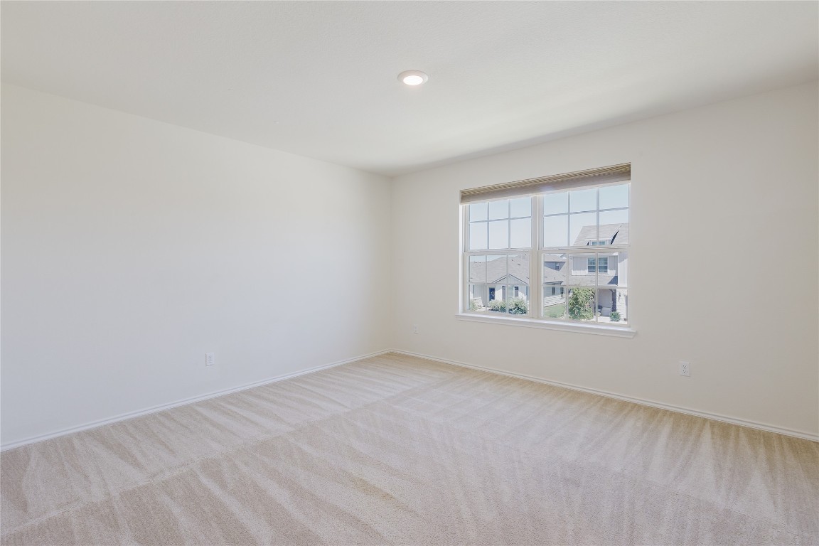 529 Gray Hawk Ridge Leander, TX 78641 - Photo 29 of 36 Spare room featuring light carpet and recessed lighting