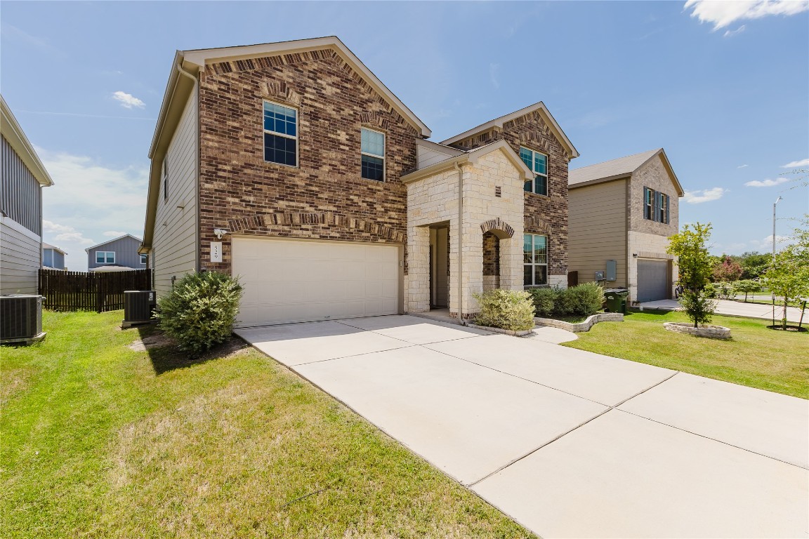 529 Gray Hawk Ridge Leander, TX 78641 - Photo 4 of 36 View of front of property with an attached garage and concrete driveway