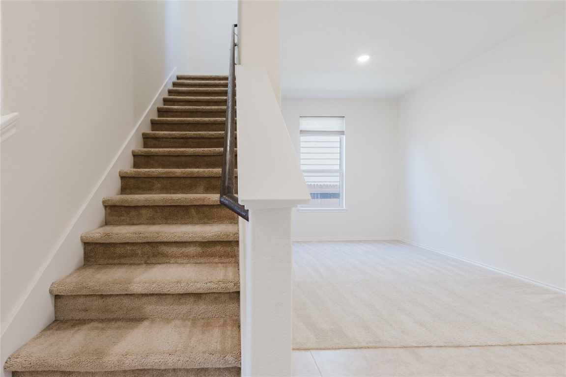 529 Gray Hawk Ridge Leander, TX 78641 - Photo 7 of 36 Stairway with carpet floors and baseboards