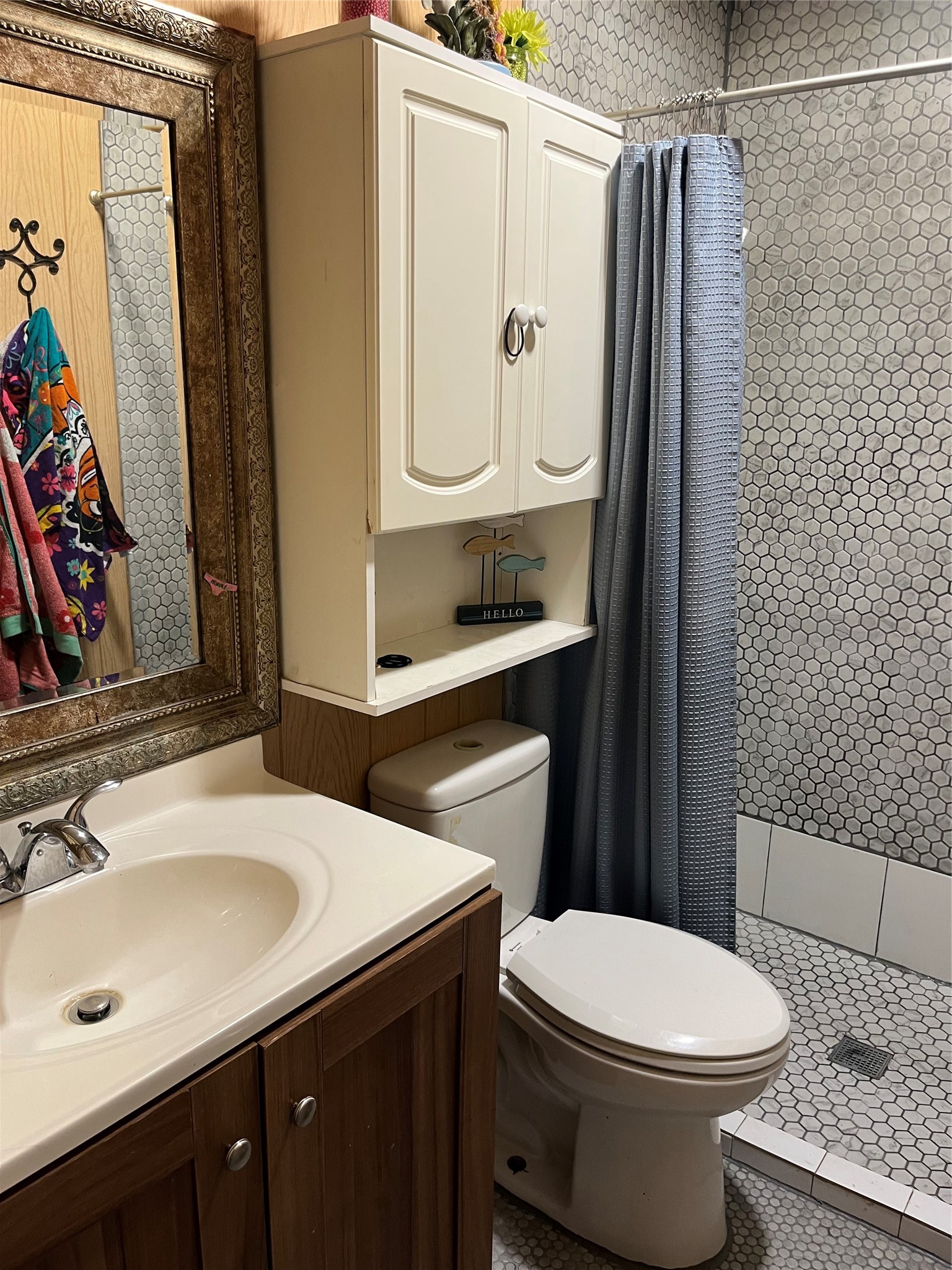 8026 Forest Trace Conroe, TX 77306 - Photo 25 of 28 a bathroom with a sink a toilet and shower
