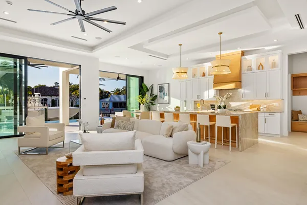 a large kitchen with stainless steel appliances granite countertop a lot of counter space and a sink