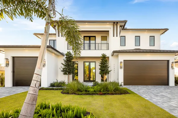 a front view of a house with garden