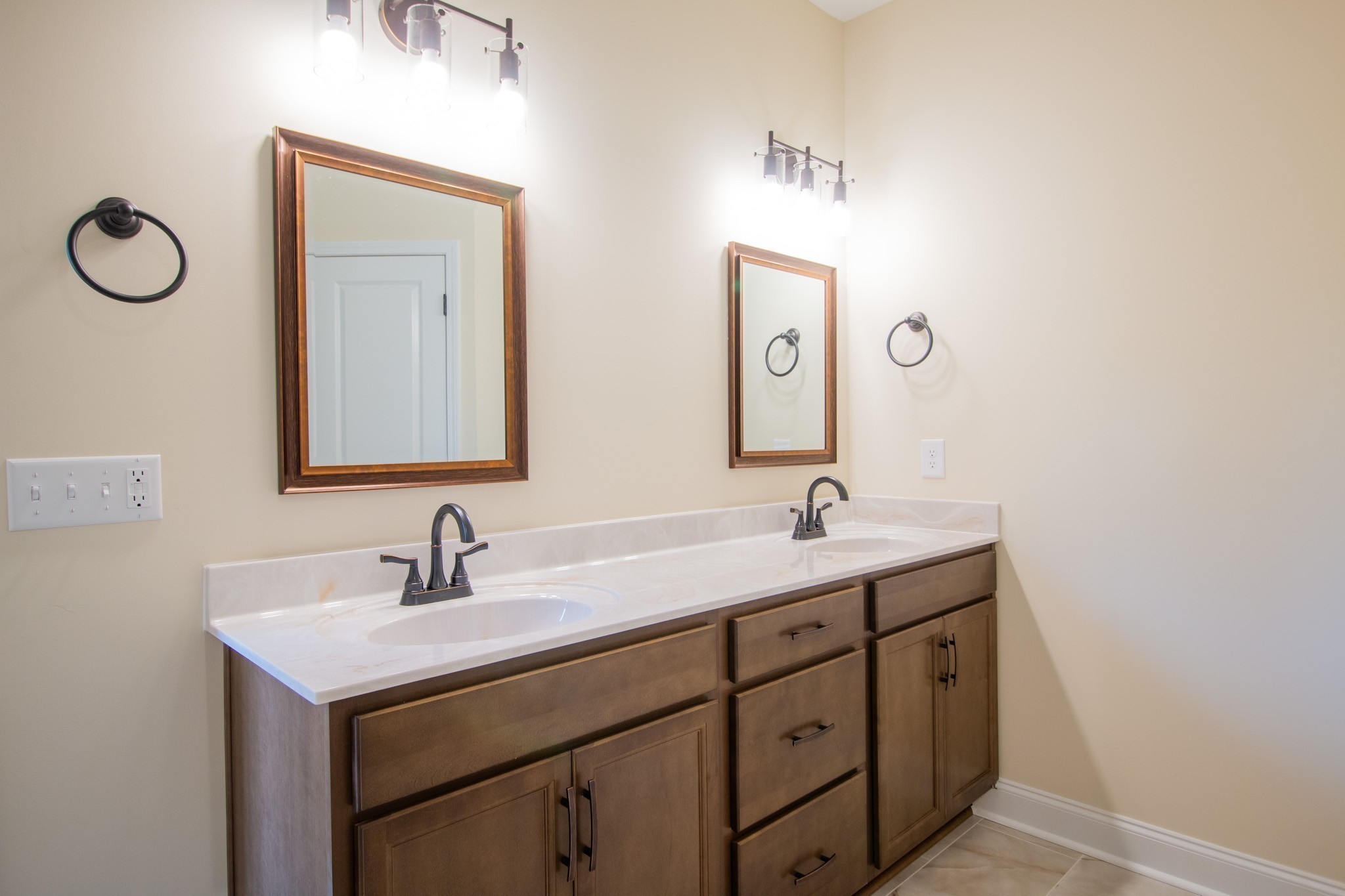 3 Rawlings Road Woodlawn, TN 37191 - Photo 15 of 21 a bathroom with a double vanity sink and a mirror