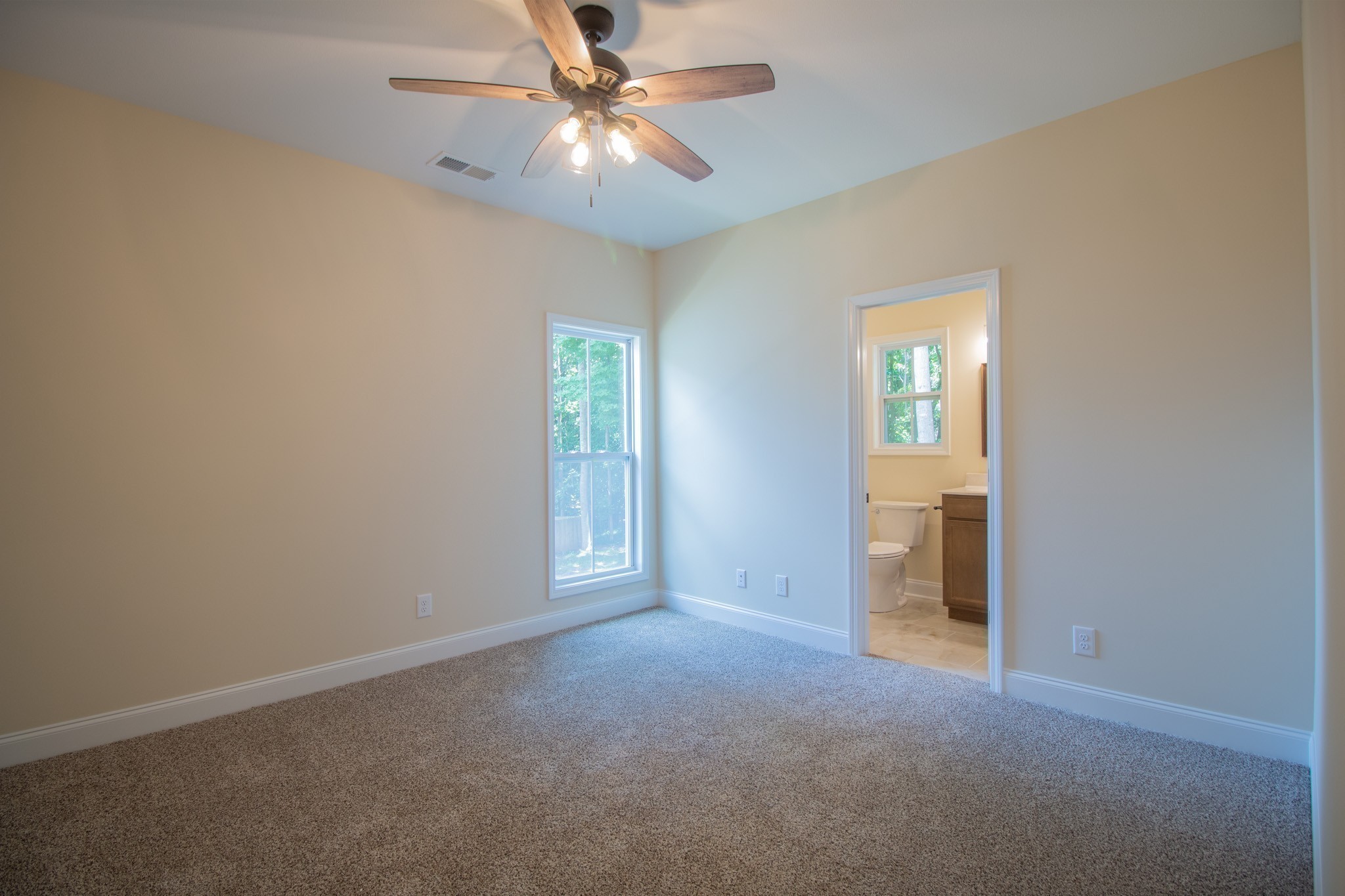 3 Rawlings Road Woodlawn, TN 37191 - Photo 18 of 21 an empty room with windows and fan