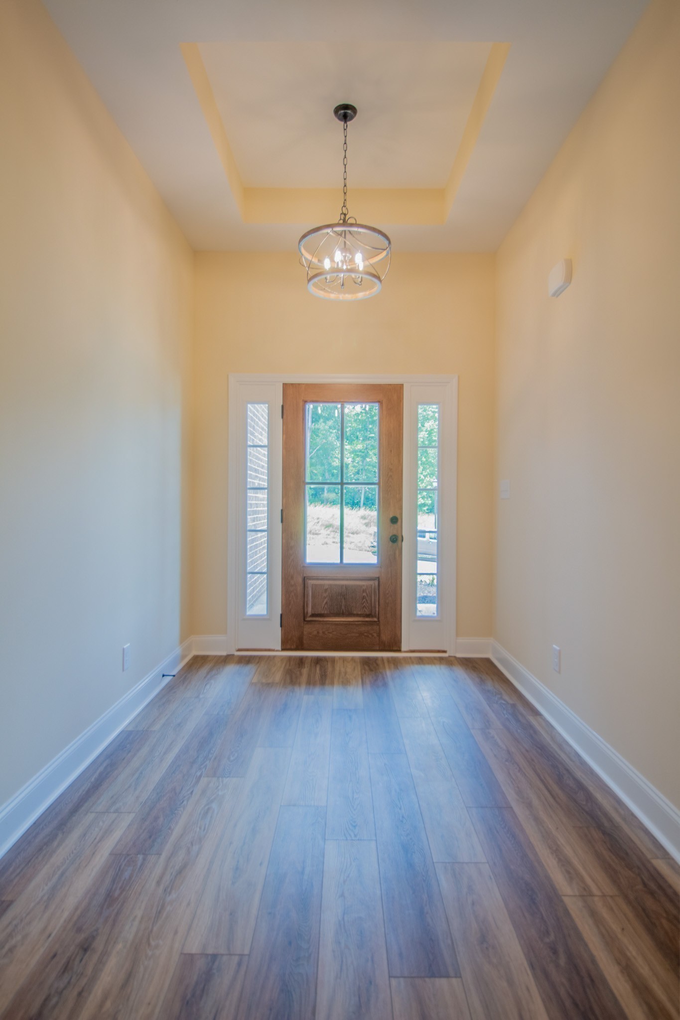 3 Rawlings Road Woodlawn, TN 37191 - Photo 5 of 21 a view of an empty room with wooden floor and a window