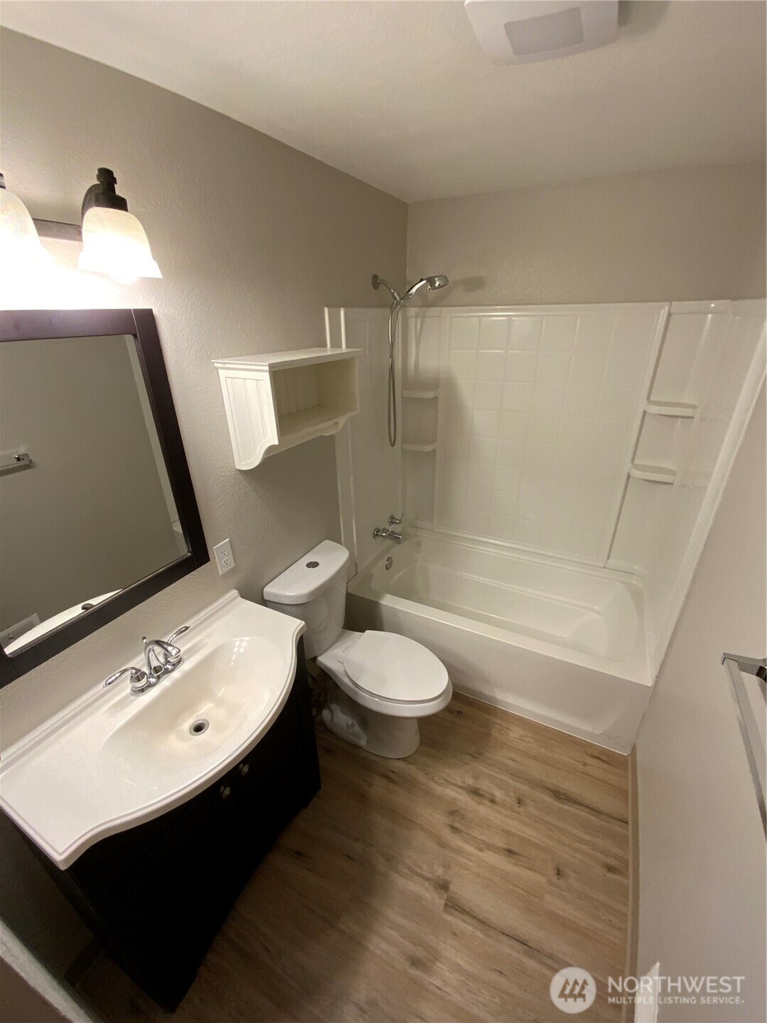 621 Brookdale Road East Tacoma, WA 98445 - Photo 9 of 14 a bathroom with a sink a toilet and shower