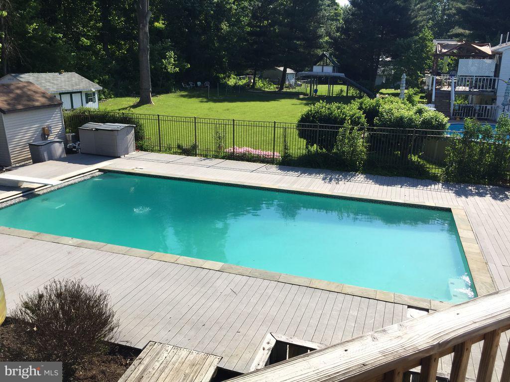1750 Walnut Road Port Republic, MD 20676 - Photo 2 of 24 Pool deck with in-ground gunite pool