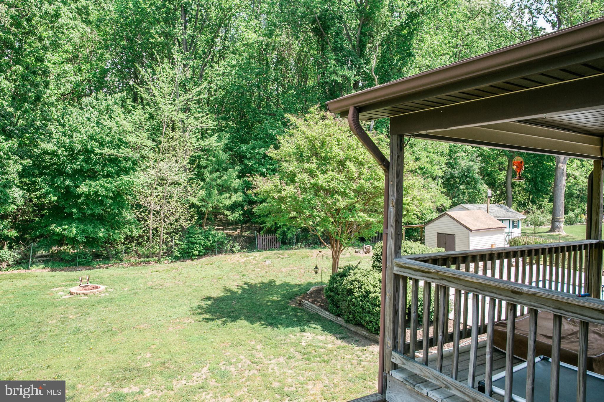 1750 Walnut Road Port Republic, MD 20676 - Photo 21 of 24 Fully fenced backyard with fire pit