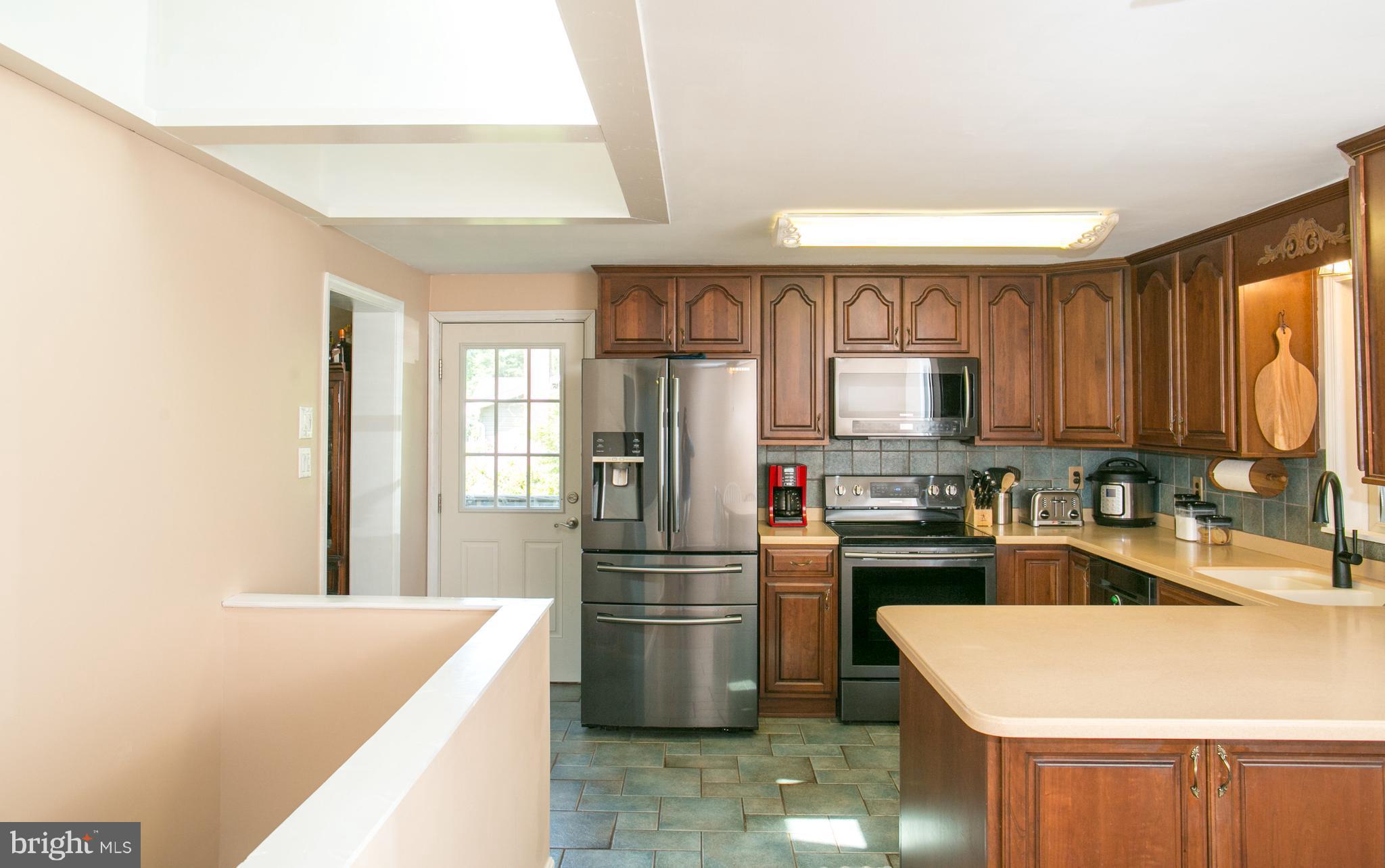 1750 Walnut Road Port Republic, MD 20676 - Photo 4 of 24 Kitchen with new black stainless appliances