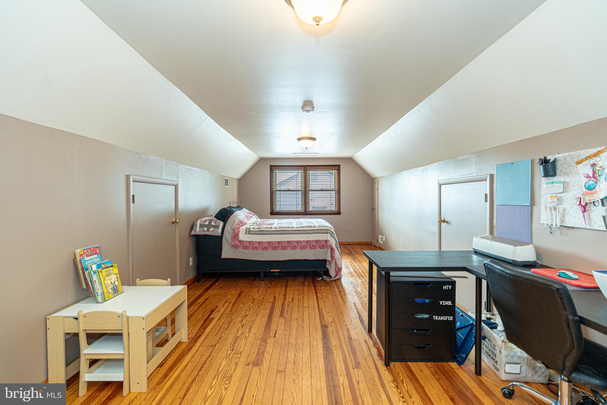 1510 Seling Avenue Rosedale, MD 21237 - Photo 13 of 24 a bedroom with a bed and wooden floor