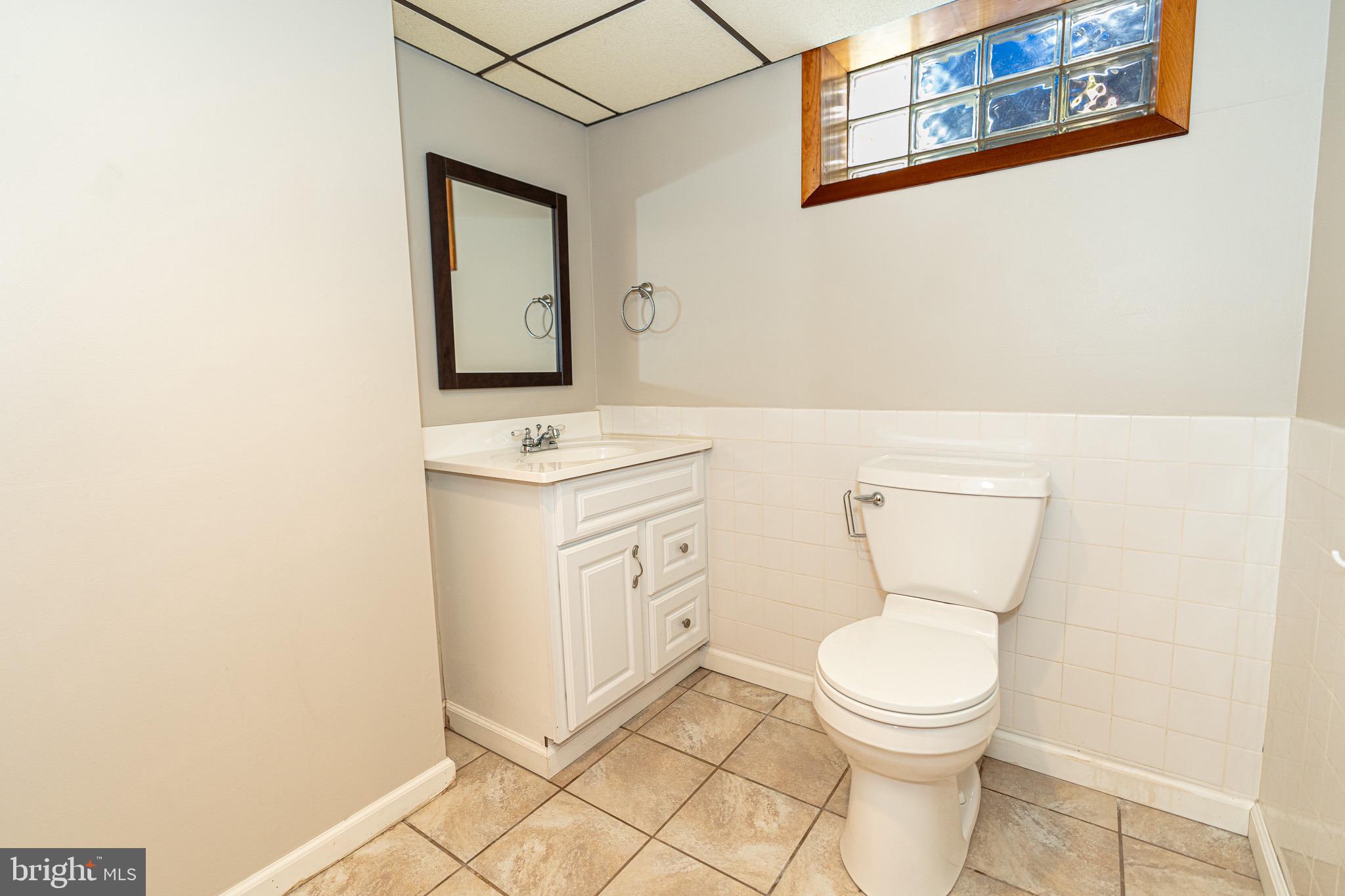 1510 Seling Avenue Rosedale, MD 21237 - Photo 18 of 24 a white toilet sitting next to a bathroom sink
