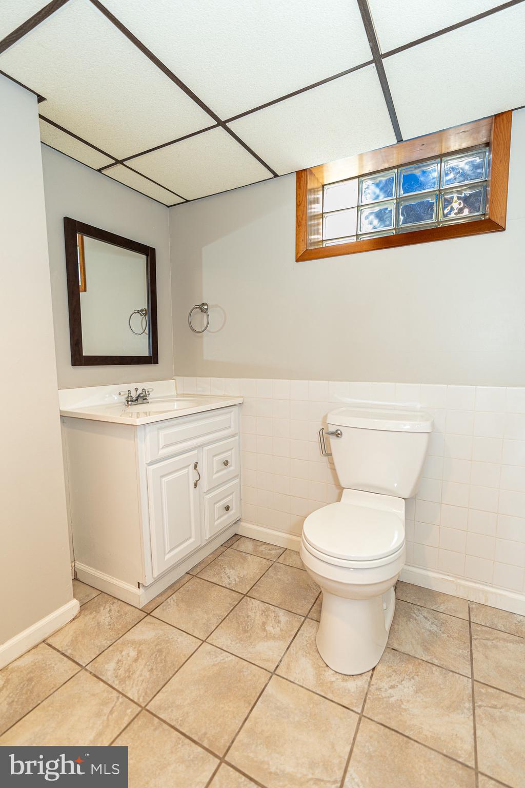 1510 Seling Avenue Rosedale, MD 21237 - Photo 19 of 24 a bathroom with a toilet sink and mirror