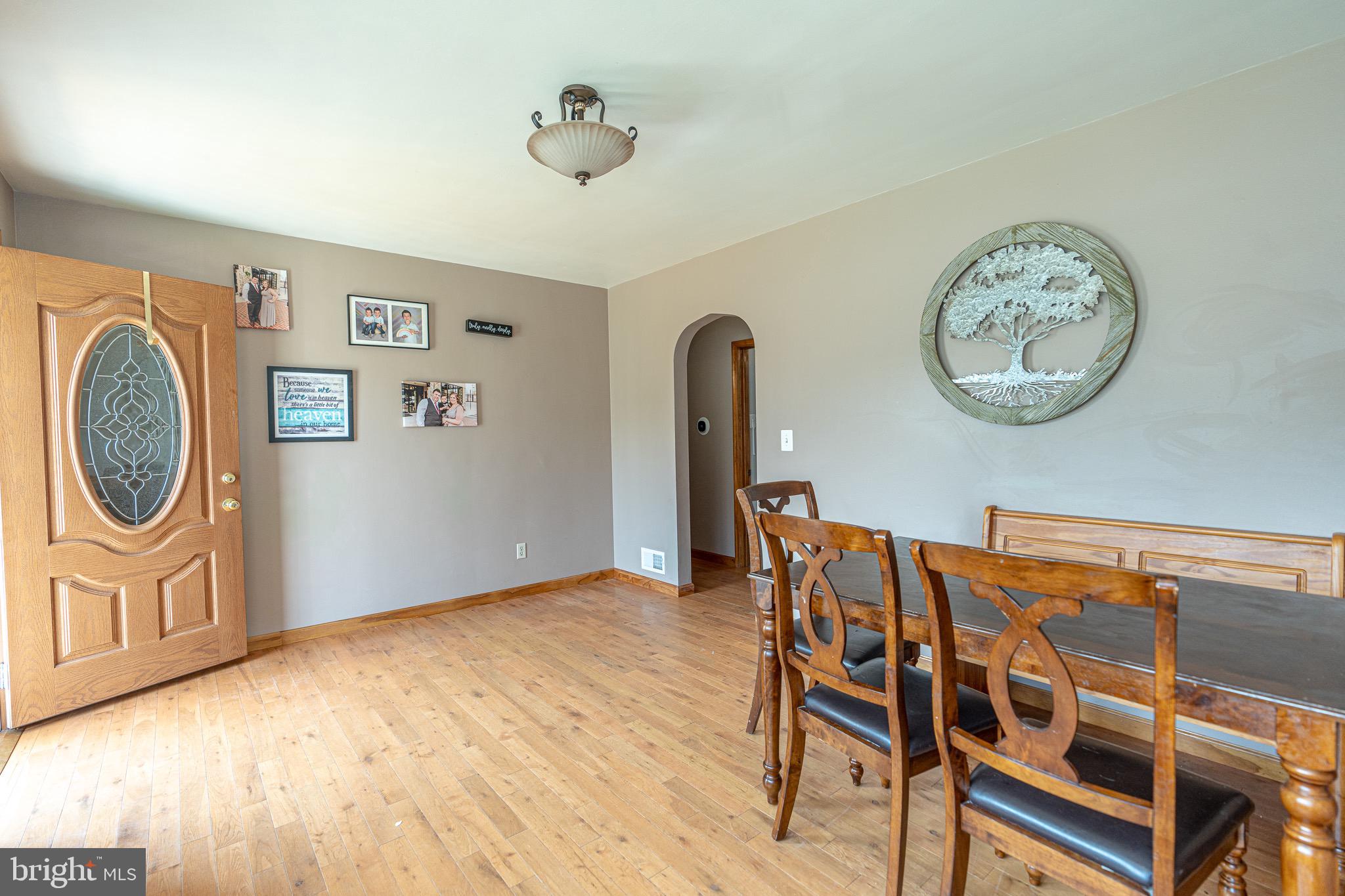 1510 Seling Avenue Rosedale, MD 21237 - Photo 2 of 24 a view of a dining room with furniture and wooden floor