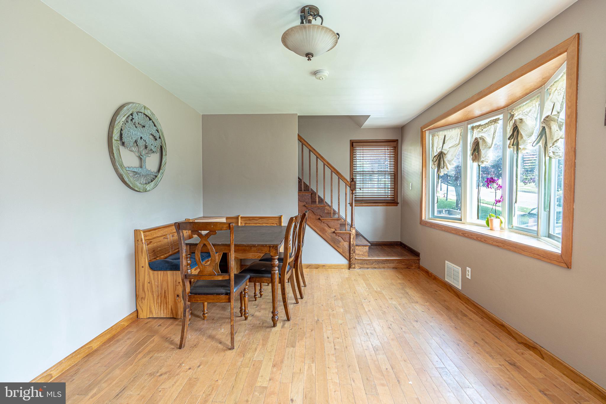 1510 Seling Avenue Rosedale, MD 21237 - Photo 3 of 24 a view of a dining room with furniture window and wooden floor