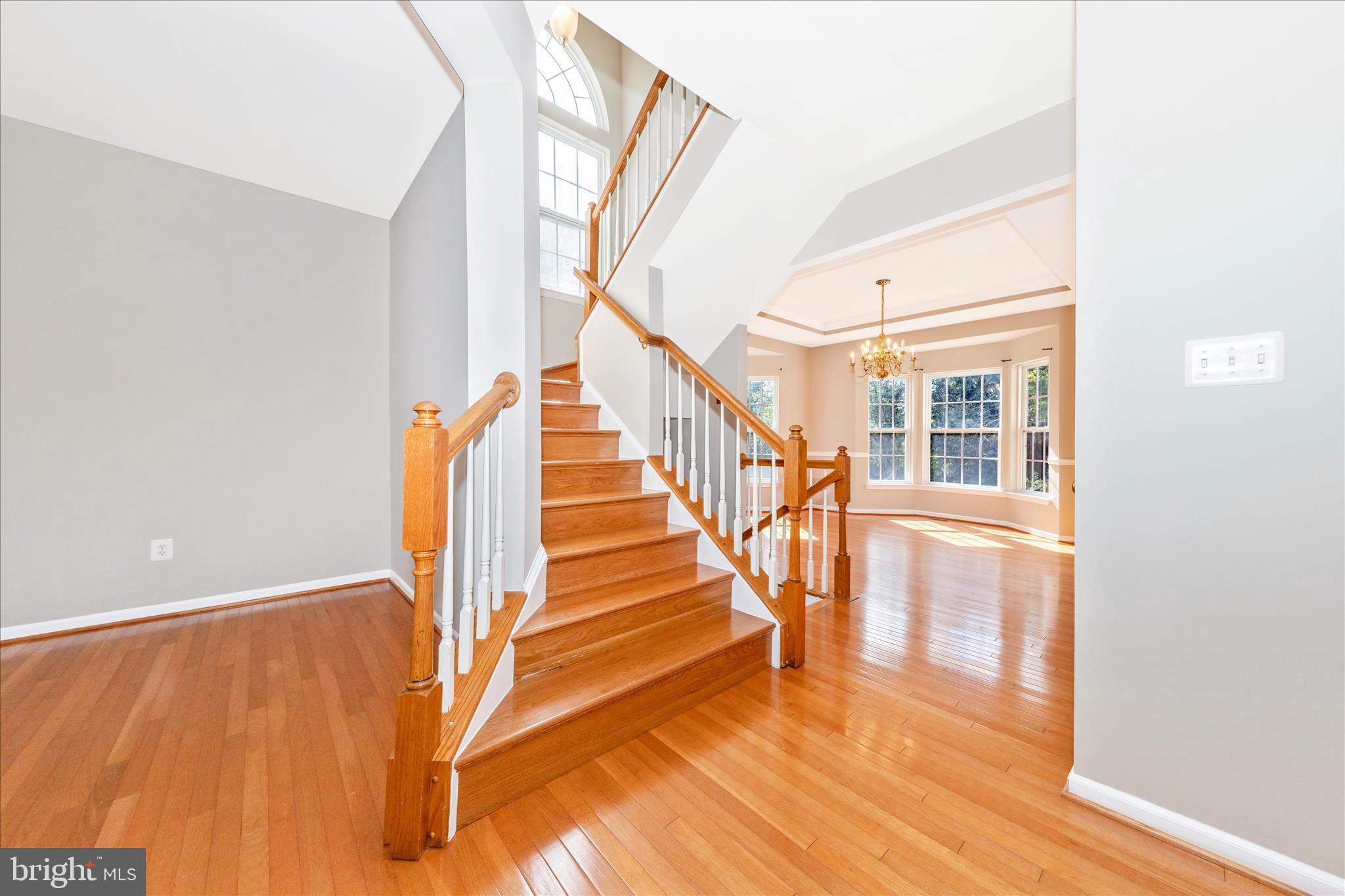 12406 Fallen Timbers Circle Hagerstown, MD 21740 - Photo 19 of 52 a view of staircase with white walls and windows