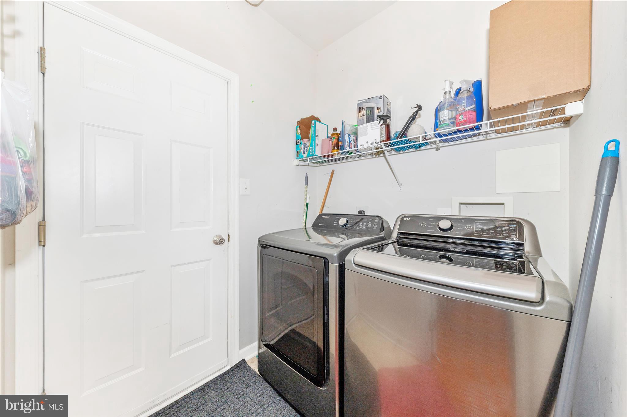 12406 Fallen Timbers Circle Hagerstown, MD 21740 - Photo 41 of 52 a utility room with dryer washer and empty racks