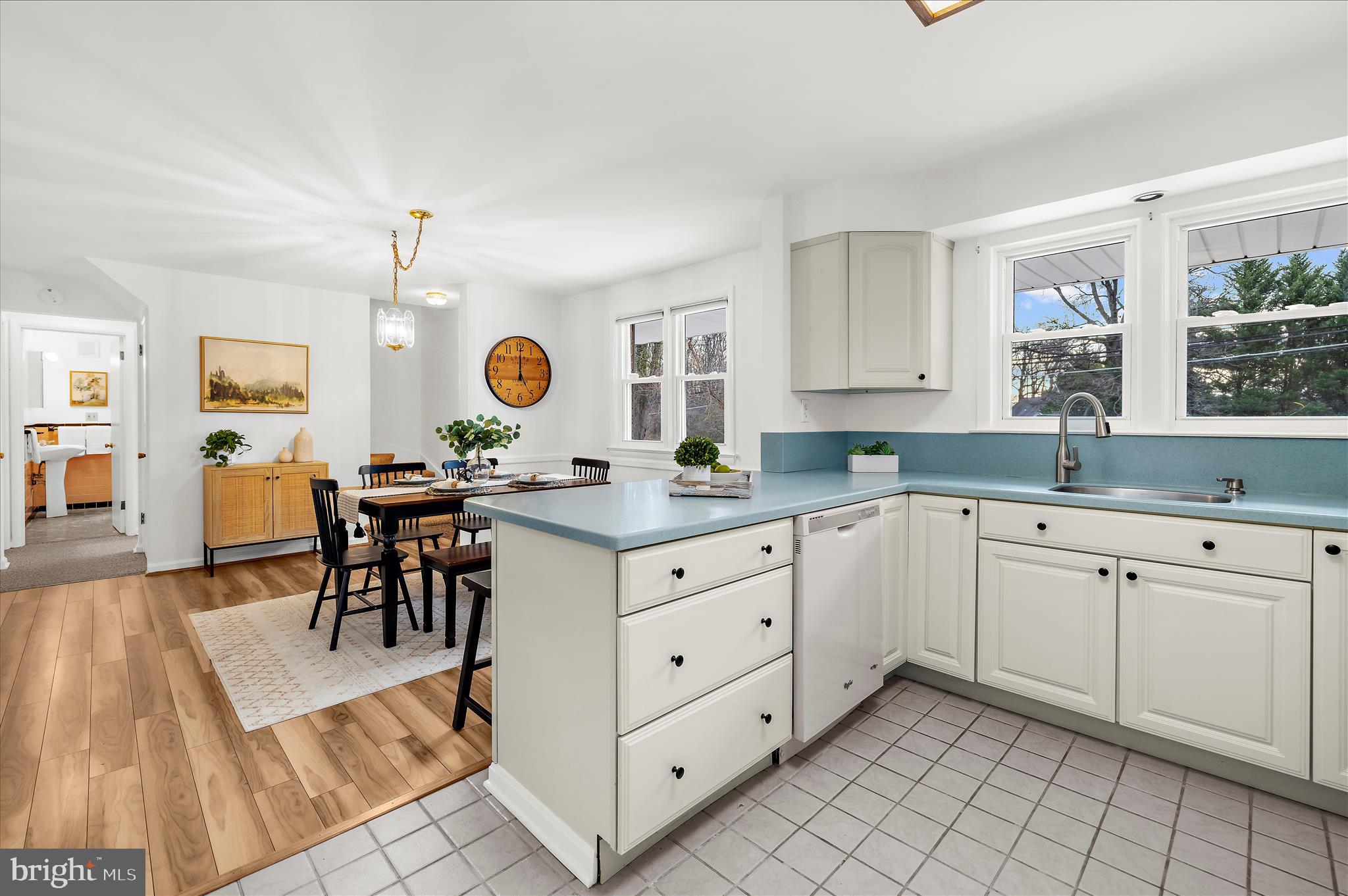 2930 Powder Mill Road Hyattsville, MD 20783 - Photo 13 of 53 a open kitchen with granite countertop a sink white cabinets and chairs