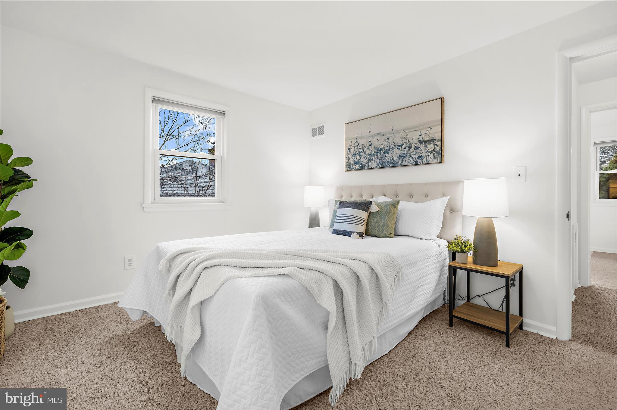 2930 Powder Mill Road Hyattsville, MD 20783 - Photo 15 of 53 a bedroom with a bed and a painting on the wall