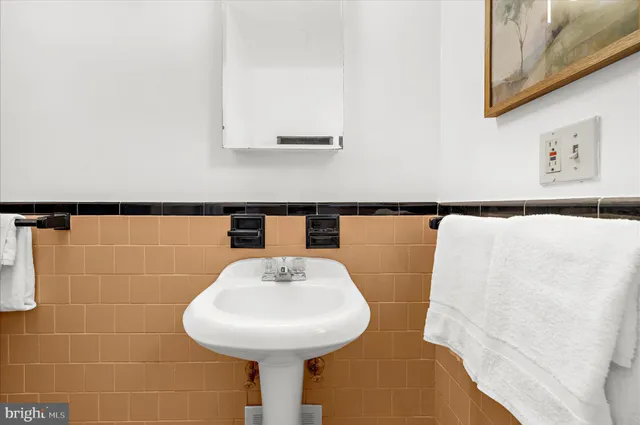 a bathroom with a white bathtub