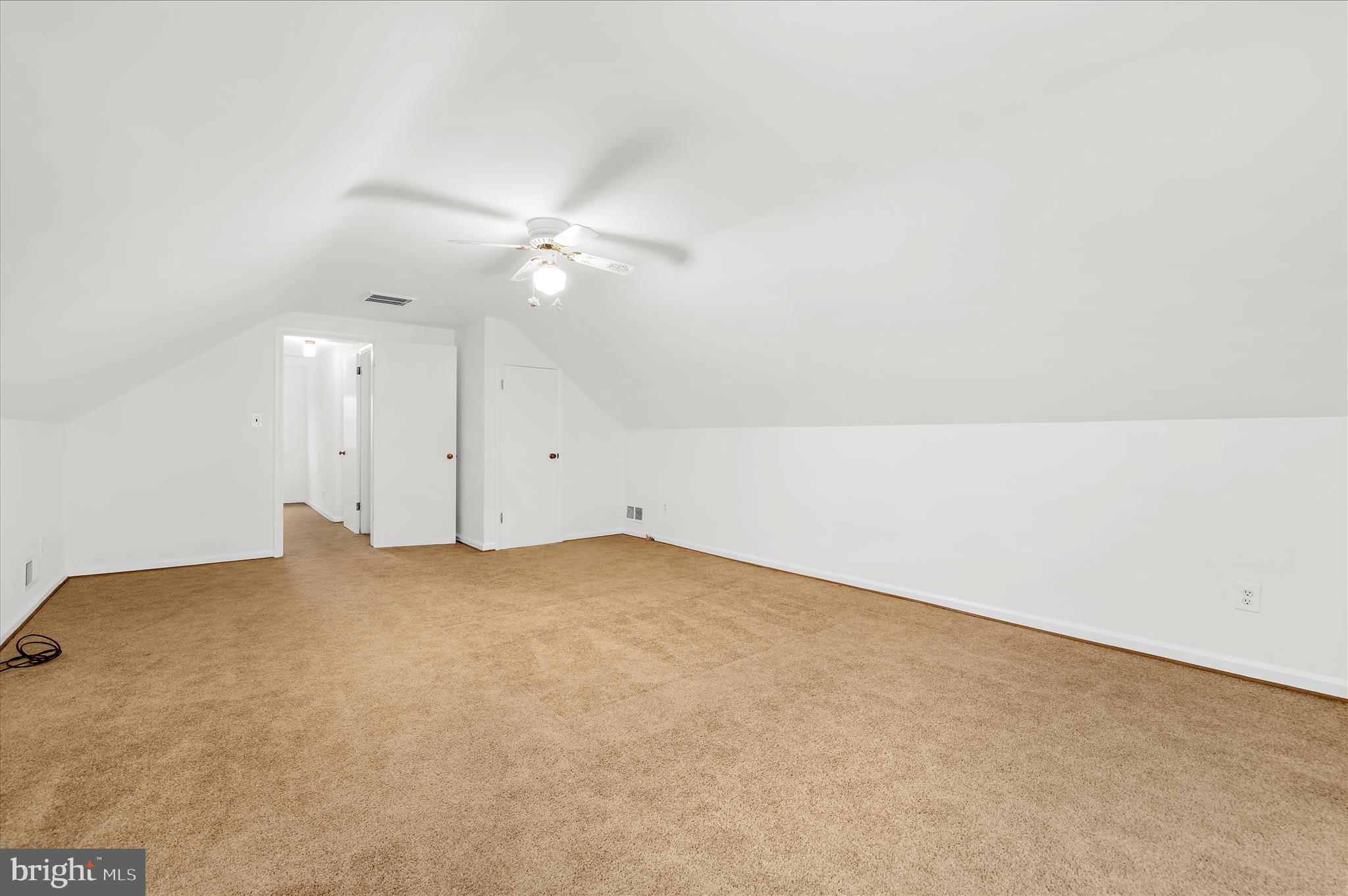 2930 Powder Mill Road Hyattsville, MD 20783 - Photo 23 of 53 an empty room with a ceiling fan and closet area
