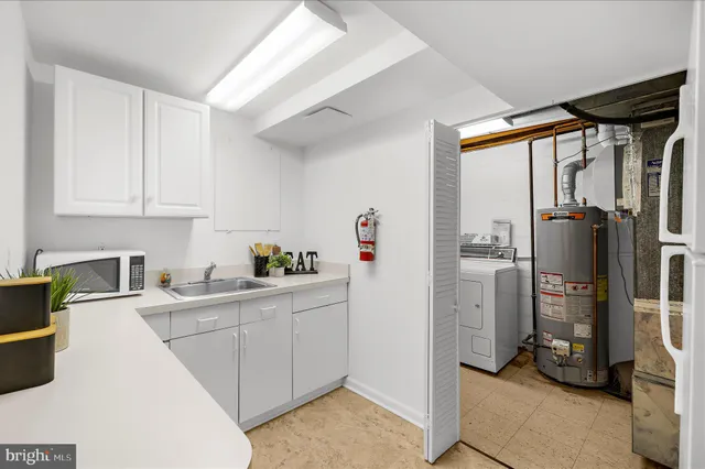 a bathroom with a toilet a sink and a mirror