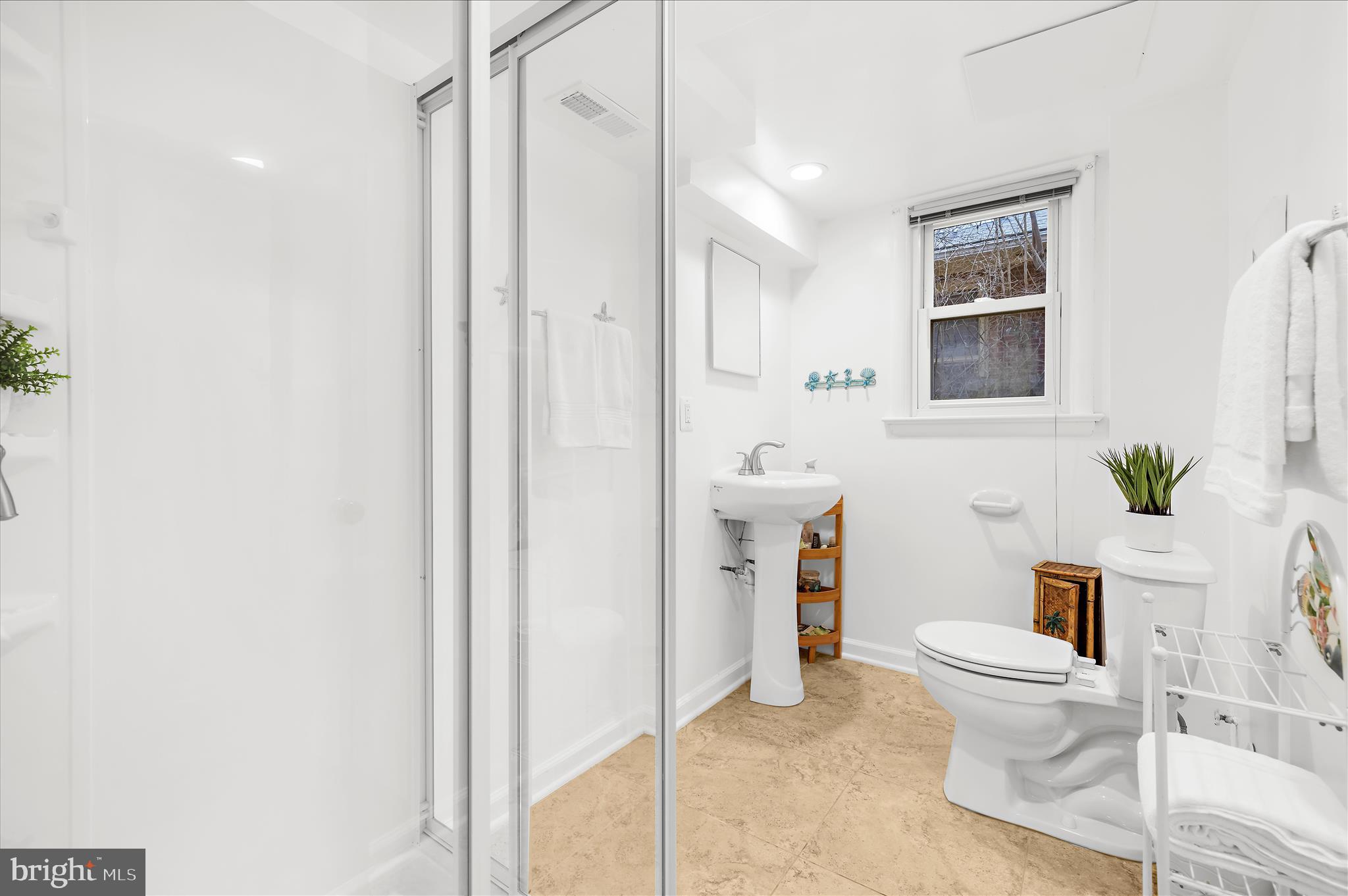 2930 Powder Mill Road Hyattsville, MD 20783 - Photo 40 of 53 a bathroom with a toilet a sink and a mirror